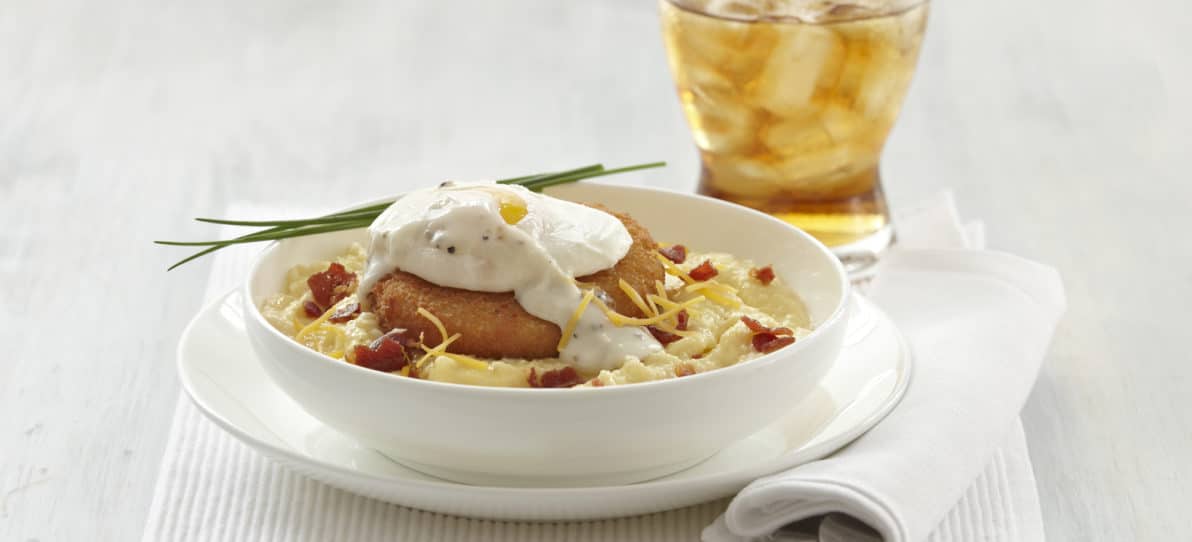 Krabbycakes® with Soft Poached Egg over Creamy Cheese Grits and Country Gravy